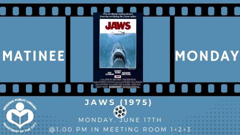 Jaws film poster in between move reel